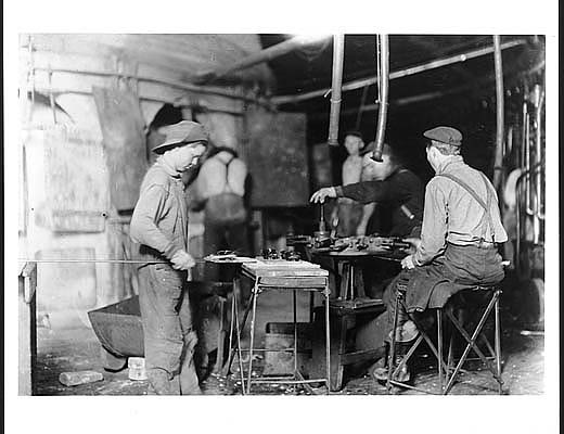 Photograph taken in October 1908 by anti-child labor activist Lewis Hine. His caption: \"Bill, a carrying-in boy, Canton Glass Works, Marion, Ind. Gets \$.80 a day or night. Others below fourteen, too. Location: Marion, Indiana.\"