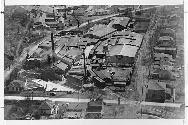 Birds-eye view of Foster-Forbes plant in N. Marion in the early 1930s, show how company had grown since taking over old Marion Flint Glass Co. facilities. Properties of Koeppen Mould, upper left, and Standard Co., rear, were to be acquired in later years.