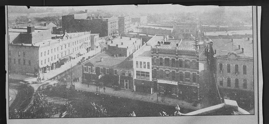 (ca. 1900) View of Spencer Hotel and drug store at corner of 4th & Adams St., looking south, photo taken from top of the Courthouse